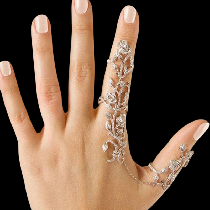 Make a bold statement with the Vintage Double Finger Chain Link Ring , a stunning fusion of vintage charm and modern elegance. This exquisite piece features a delicate chain link design adorned with sparkling rhinestones, creating an intricate floral motif that captures attention from every angle. Designed to be worn across two fingers, this ring adds a touch of sophistication and flair to any outfit, making it perfect for parties, special occasions, or even as a standout accessory for everyday wear. Its adjustable fit ensures comfort for both women and girls, while the timeless design makes it a versatile addition to any jewelry collection.